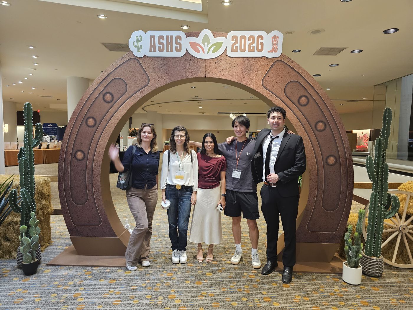 CIRCAS Lab researchers posing under the ASHS 2026 arch in Dallas